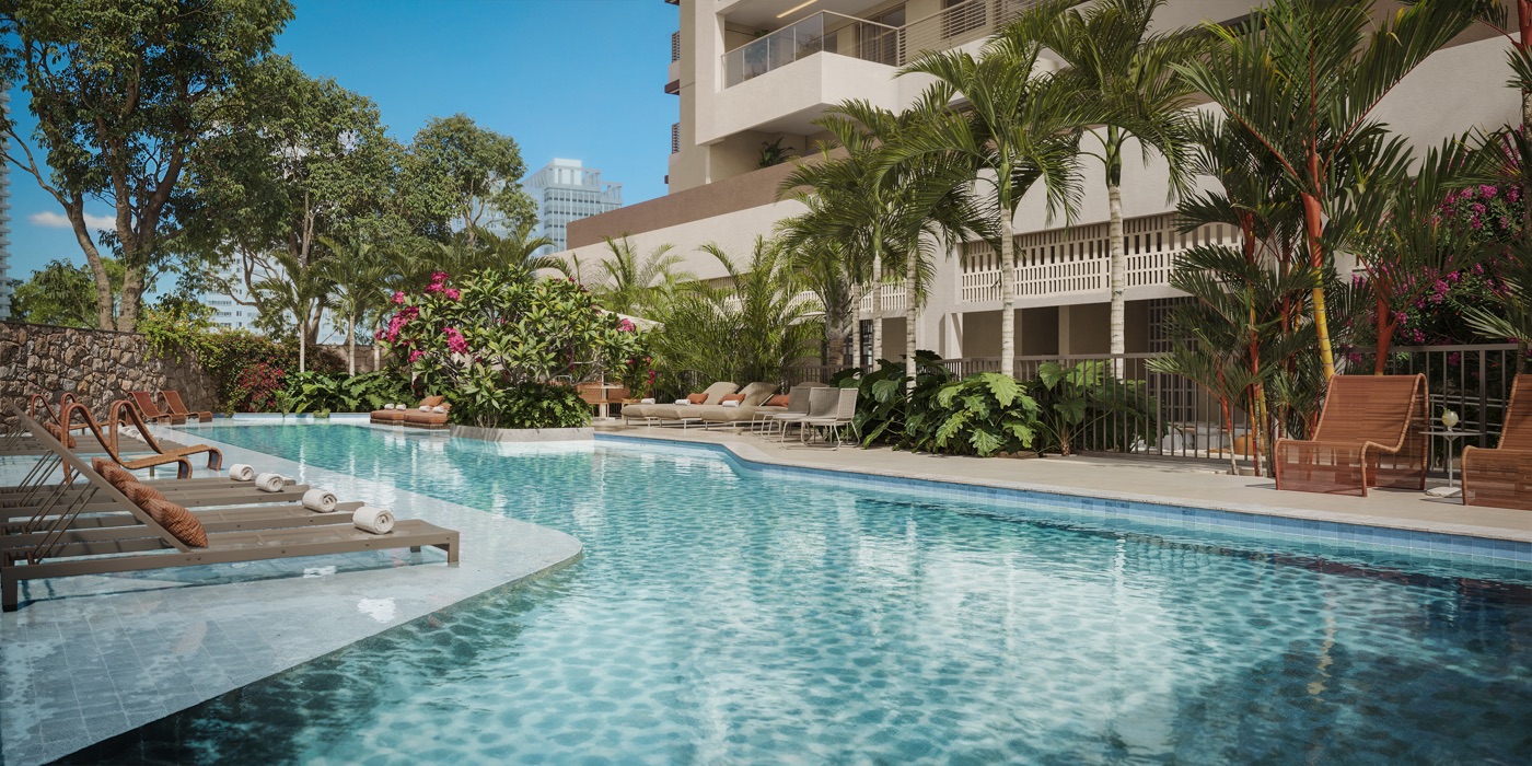 Piscina com deck, espreguiçadeiras, palmeiras e a torre ao fundo